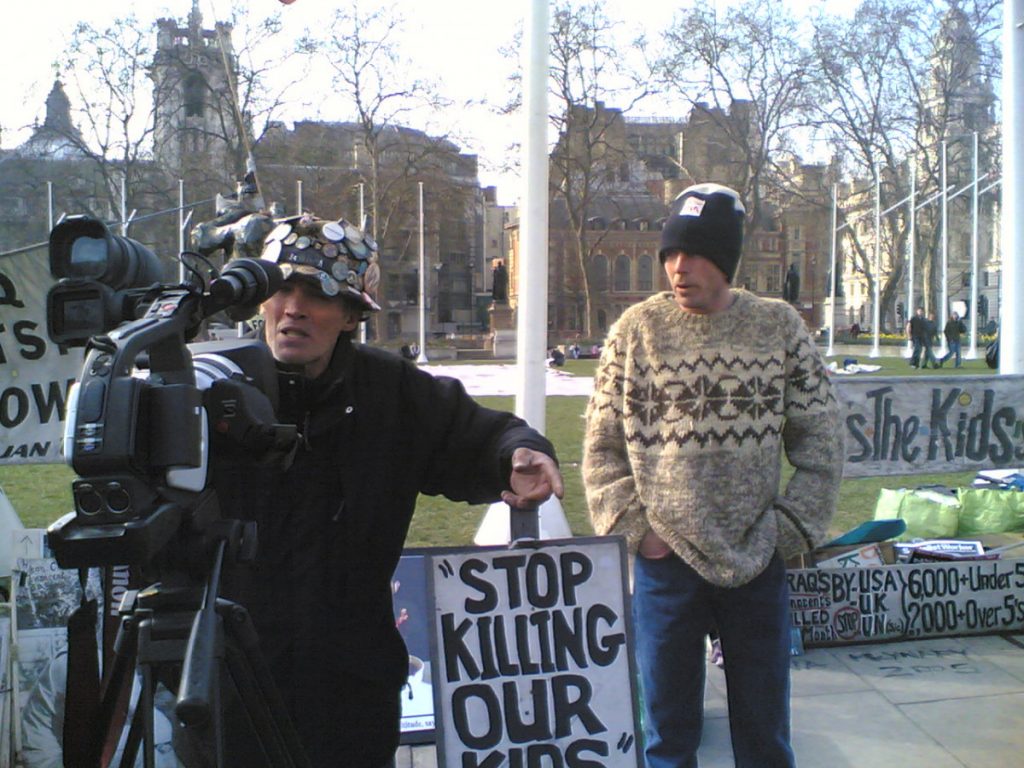 Outside Parliament - to the left Brian Haw, to the right John Navin